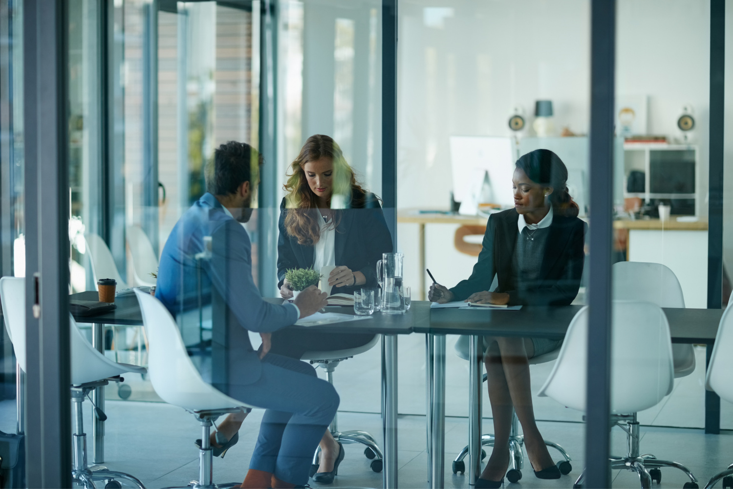business people discussing registered agent documents as a team in an office