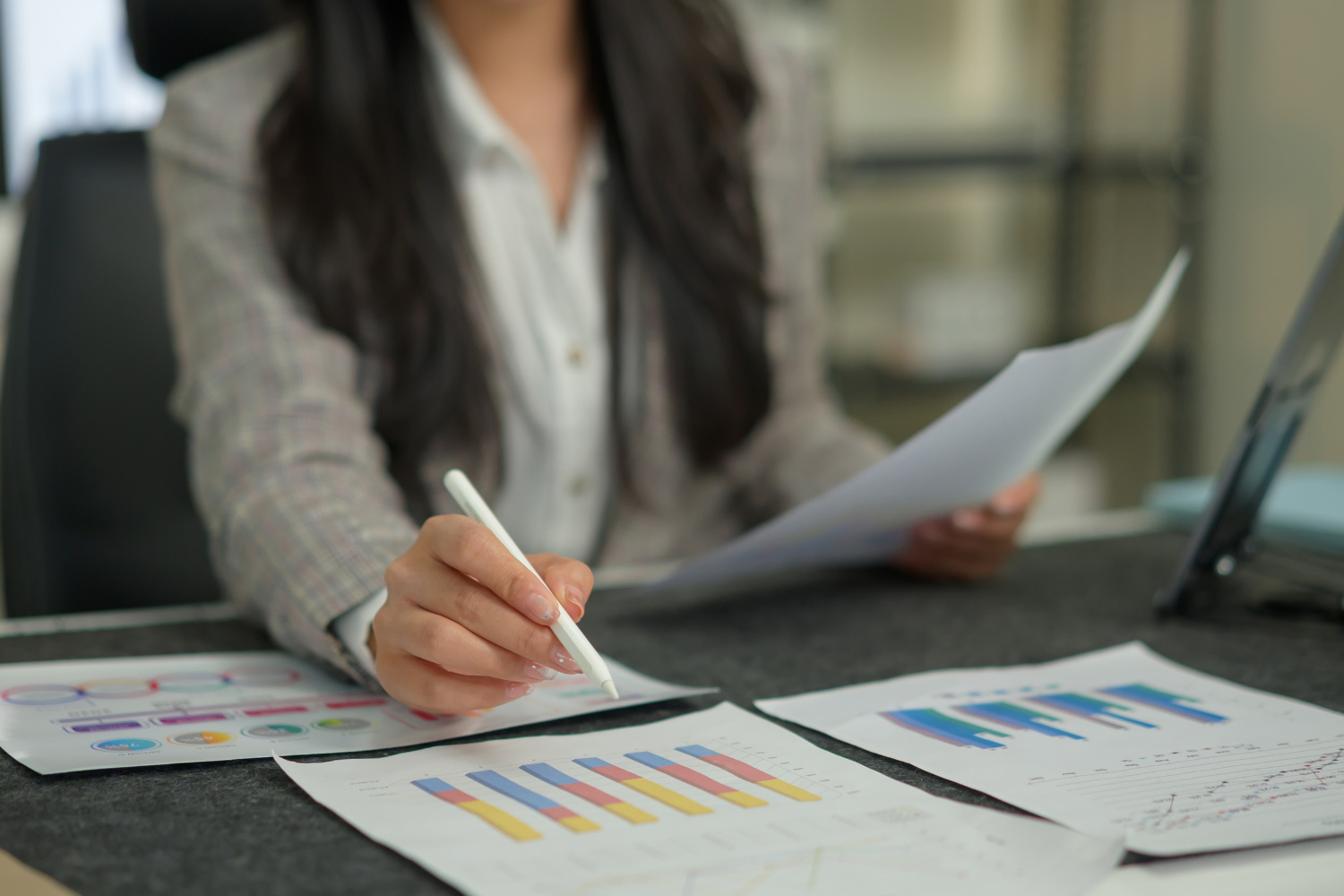 nonprofit administrator reviewing compliance documents and formation filings